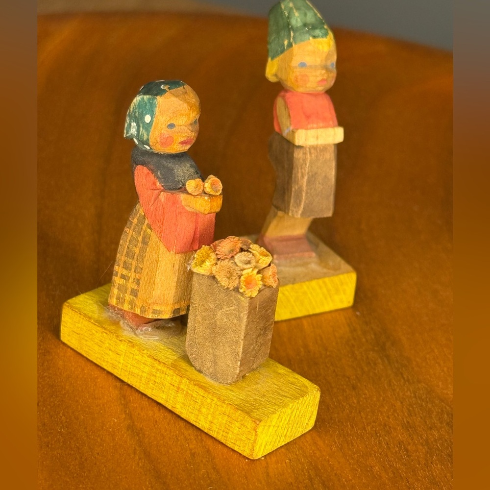 Vintage Erzgebirge girl with flowers hand carved figurine